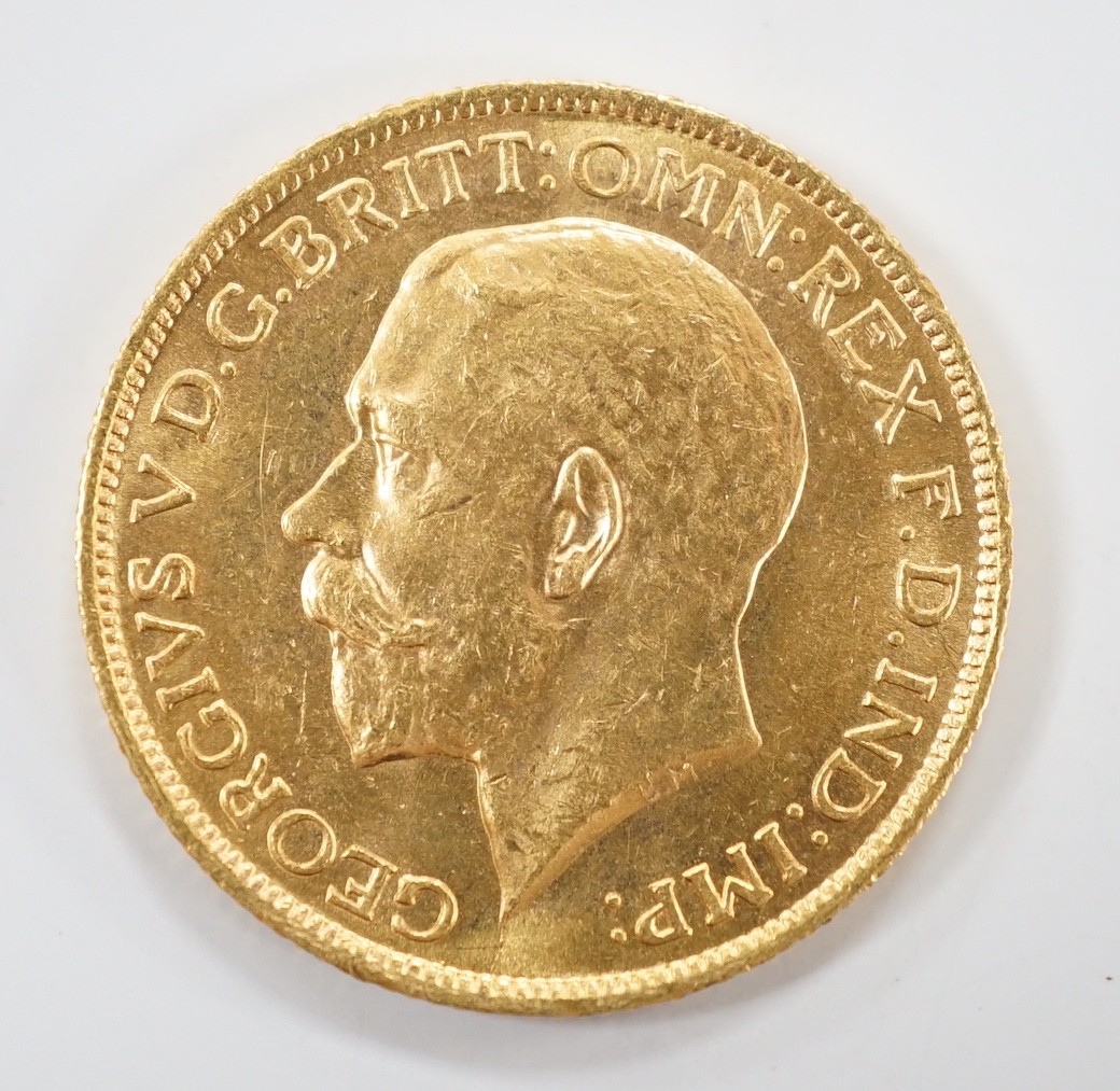 A George V gold sovereign 1911S, in case